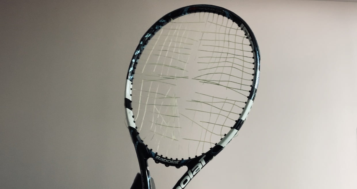 How do you cut a tennis racket string?